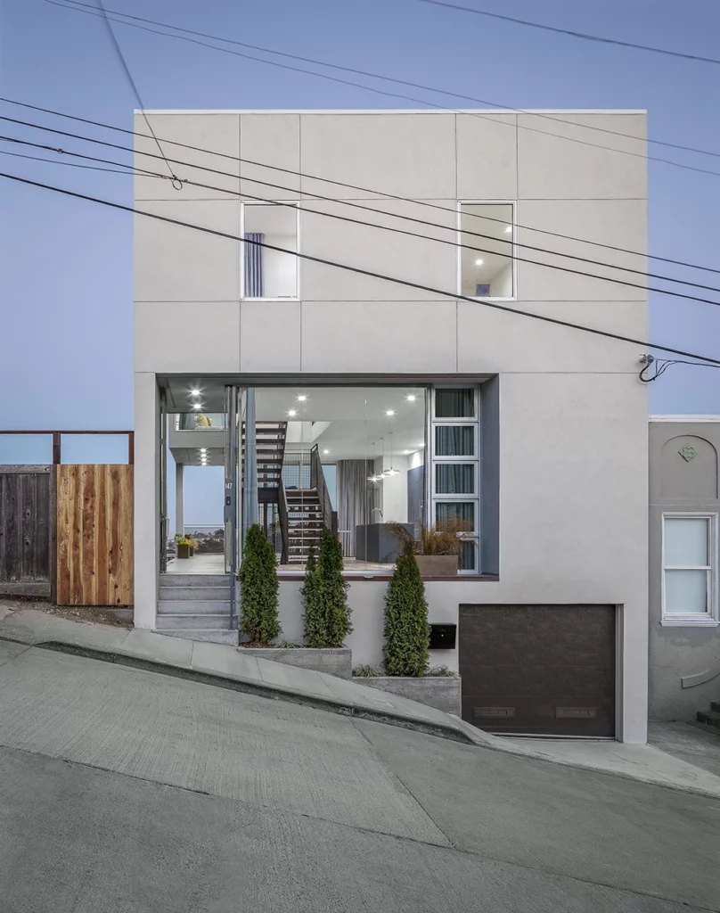 A modern, custom home San Francisco with a garage on the side of the street.