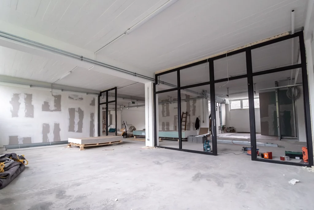Commercial tenant improvement San Francisco room that is under construction with a glass wall.