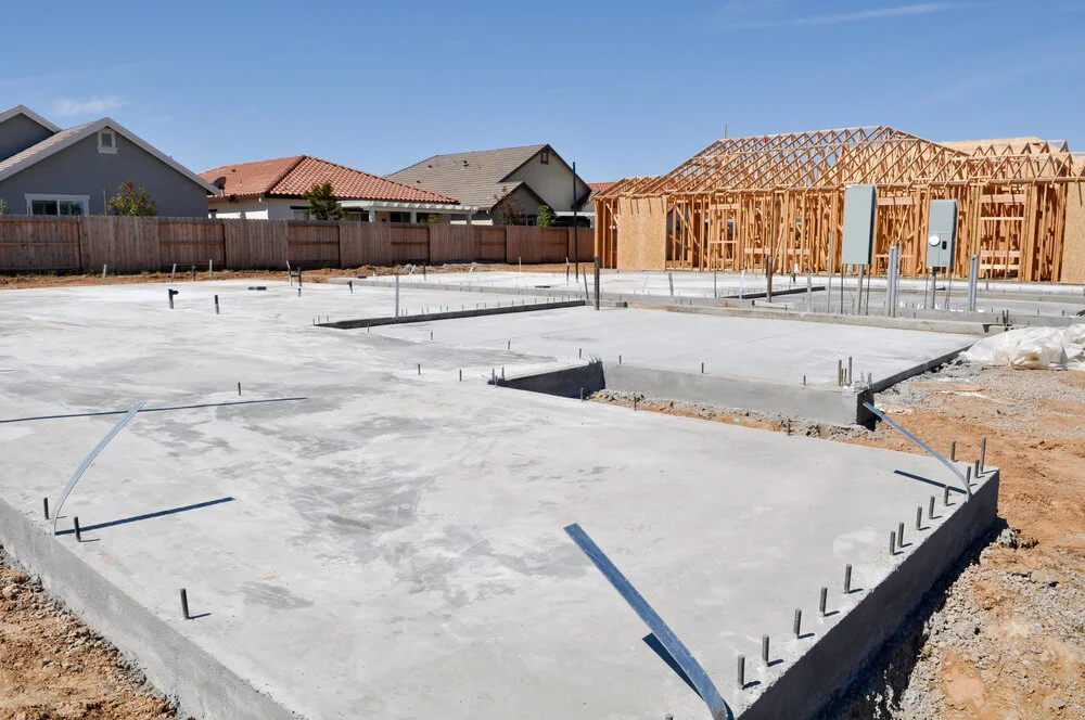 A house under construction by a foundation contractor San Francisco with a concrete foundation.