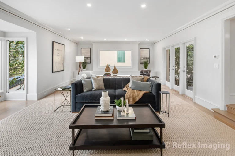A living room with a couch and coffee table.