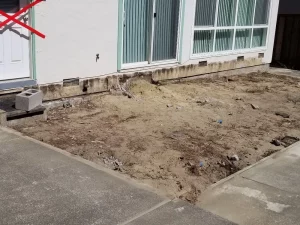 A house with a front yard that is being worked on by concrete contractors San Francisco.