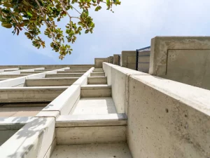 Concrete side of a building with balconies that was a project consulted by leading resilience advisor San Francisco.