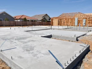 A house under construction by a foundation contractor San Francisco with a concrete foundation.